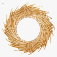 Decorative mirror in rotin in the shape of sun for interior decoration