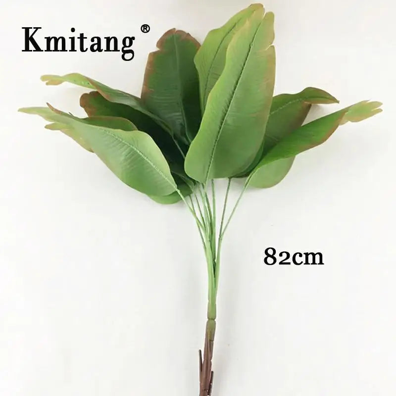 Large artificial plants monstera and banana tree for interior decoration