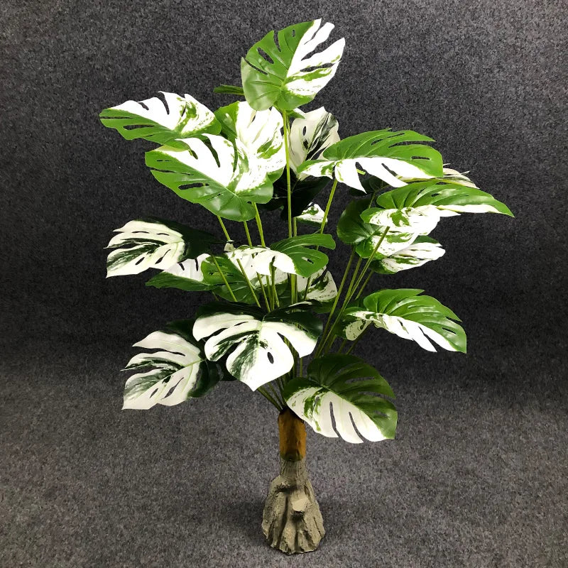 Large artificial plants with decorative palm leaves