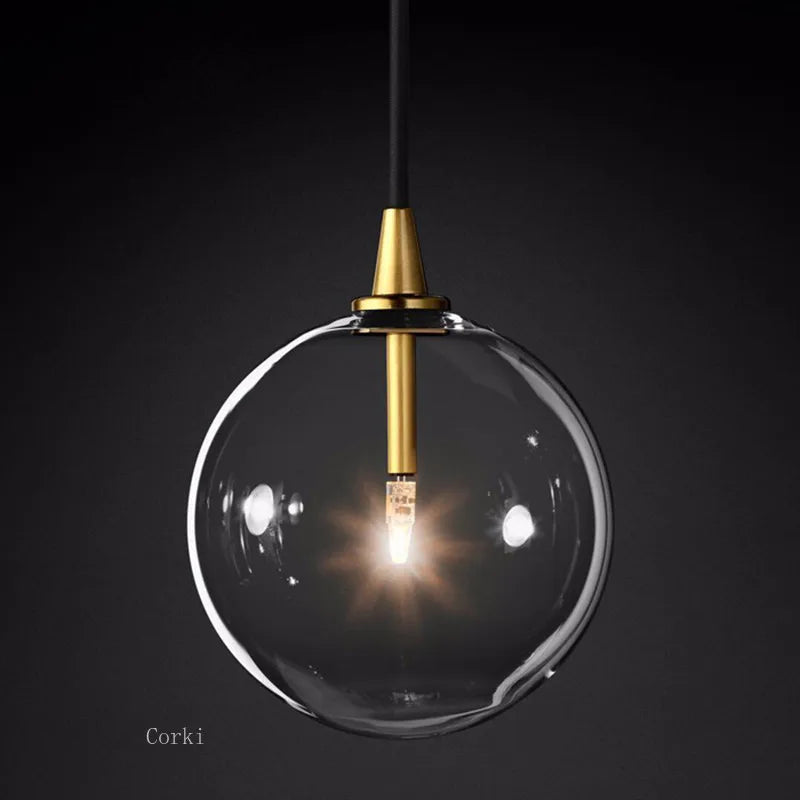 Transparent glass pendant light with modern and vintage bubbles