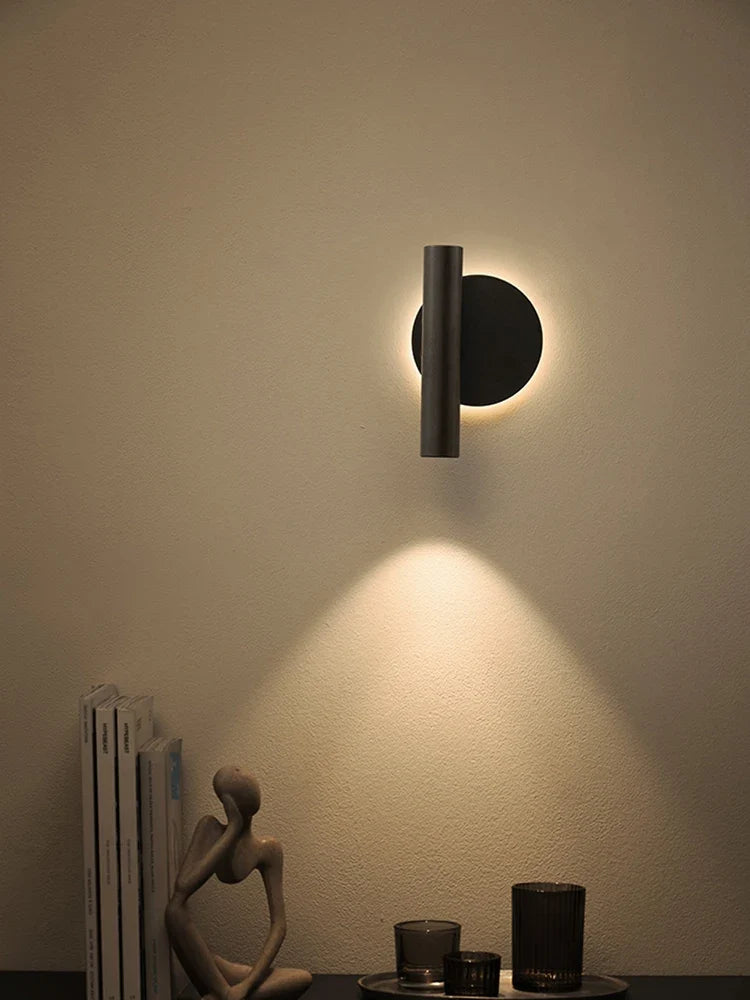 Modern minimalist wall sconce with double rotating light source