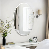 Oval decorative mirror without frame for elegant interior