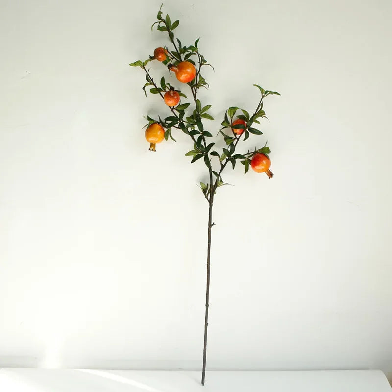 Garden decoration with artificial grenades and green plants - Orange