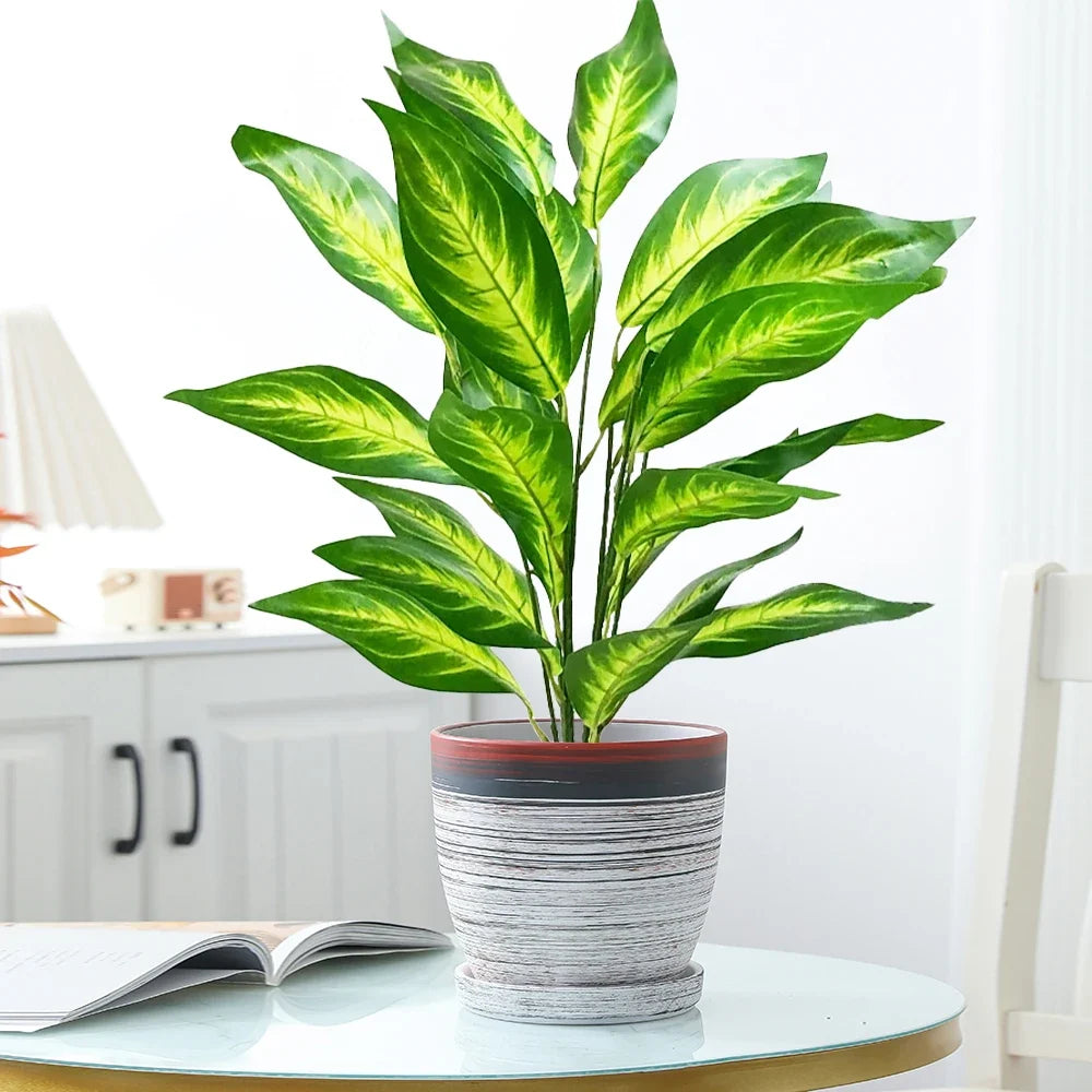 Large artificial tropical plant with leaves for interior decoration