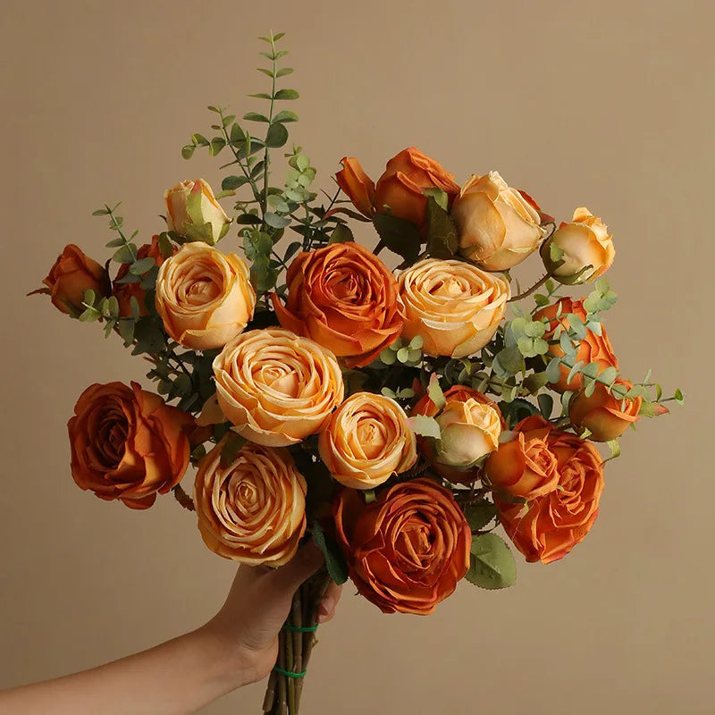 Bouquet of artificial silk rose wines for wedding interior decoration