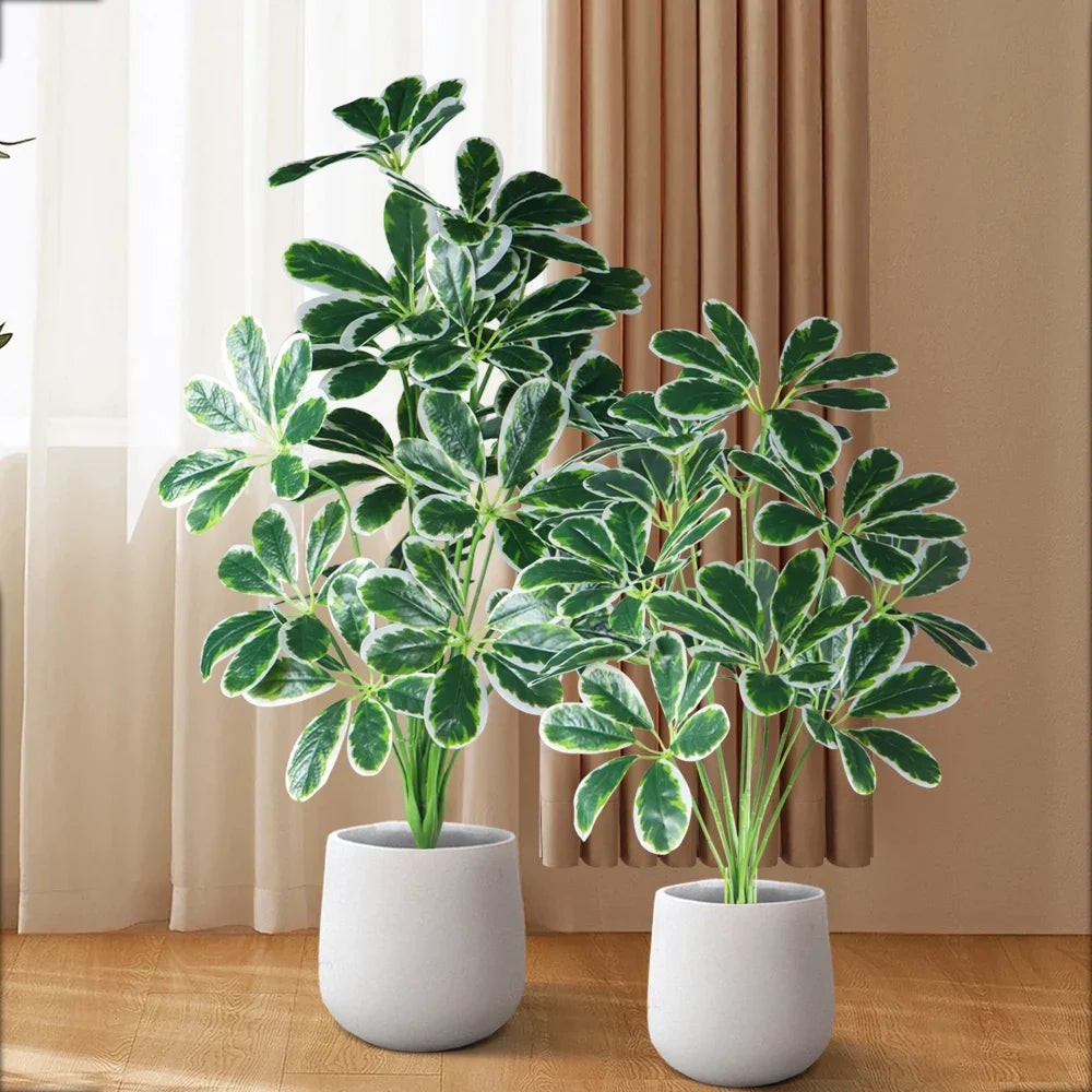 Artificial palm plants and monstera for interior and exterior decoration