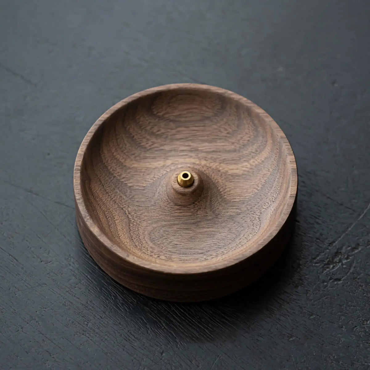 Round incense burner in wood for meditation and interior decoration