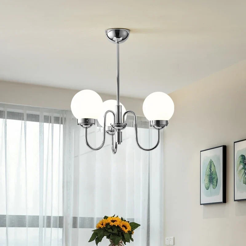 Minimalist pendant light in glass and iron for modern spaces
