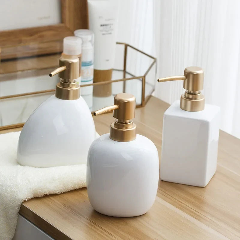 Ceramic soap dispenser with golden pump for bathroom