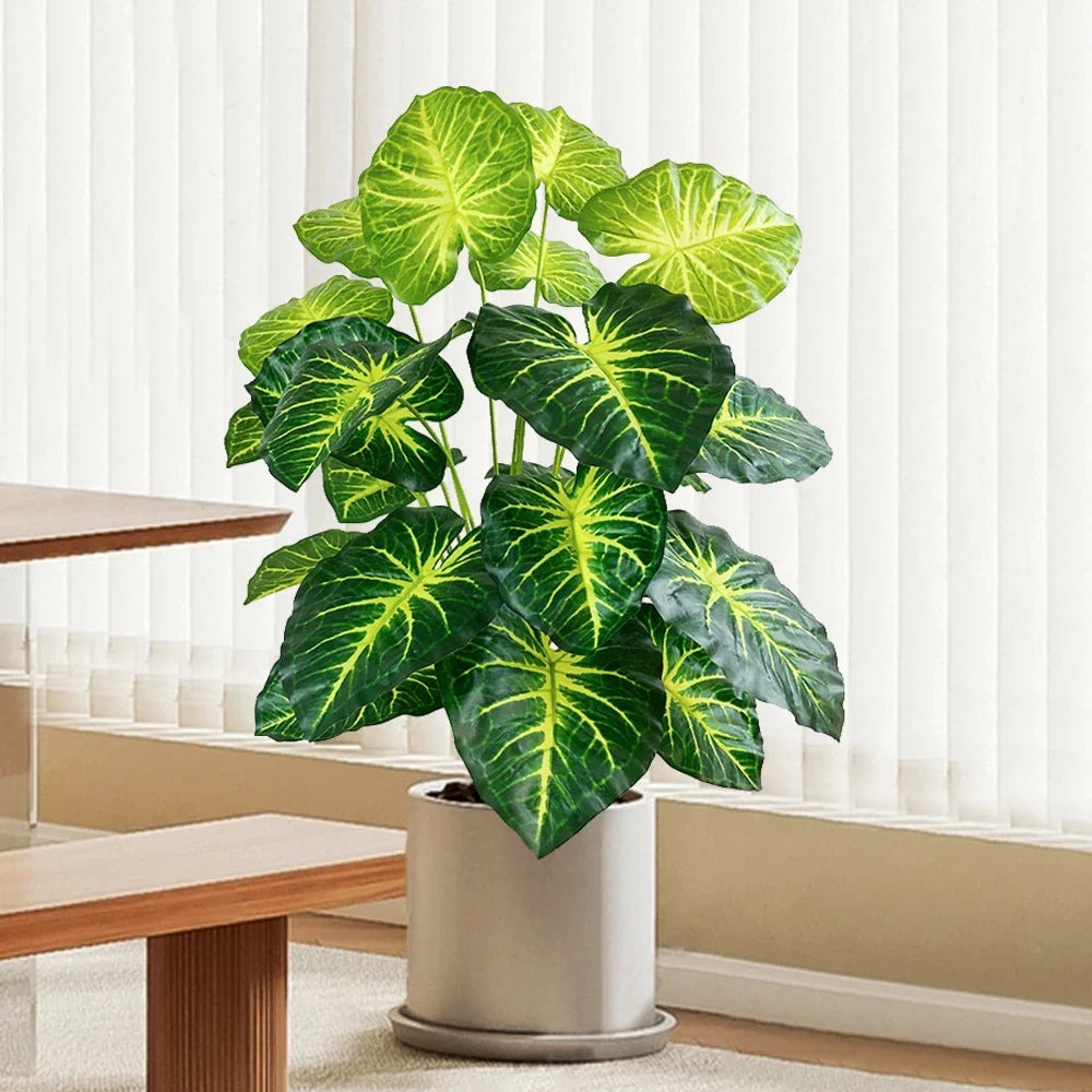 Artificial tropical turtle with decorative leaves and branches