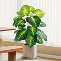 Artificial tropical turtle with decorative leaves and branches