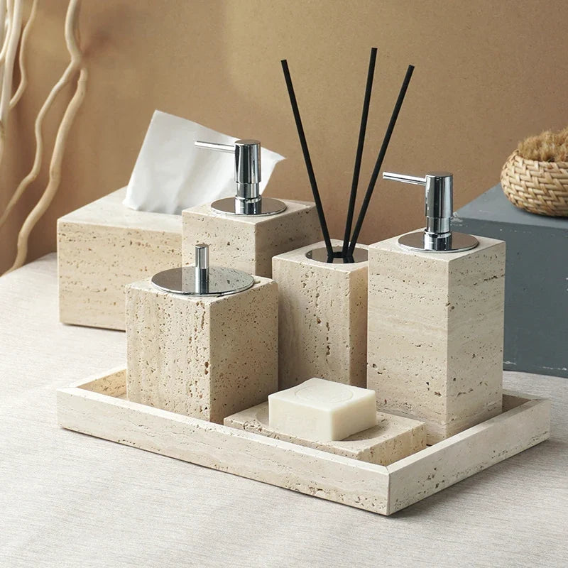 Elegant set of accessories in travertine for the bathroom