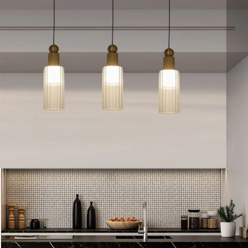 Modern pendant light in glass and copper with interchangeable cords