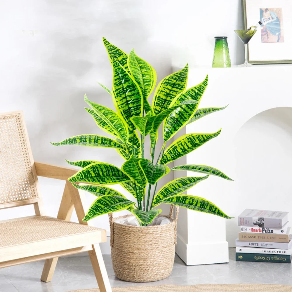 Artificial plant tropical monstera with decorative leaves for indoor garden