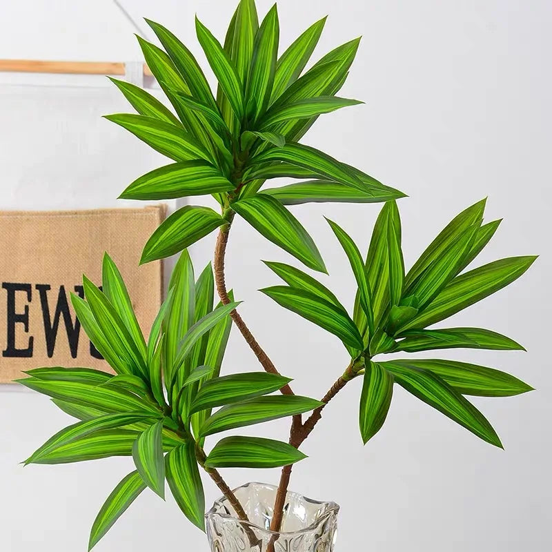 Tropical pot plant with palm and decorative bamboo