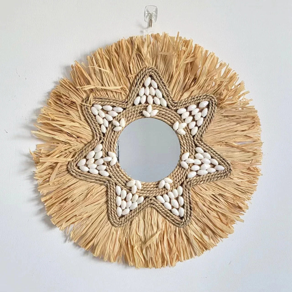 Decorative mirror in raffia and shells for wall decoration
