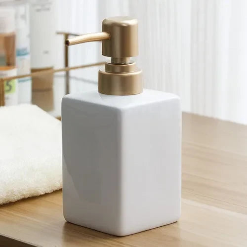 Ceramic soap dispenser with golden pump for bathroom - One