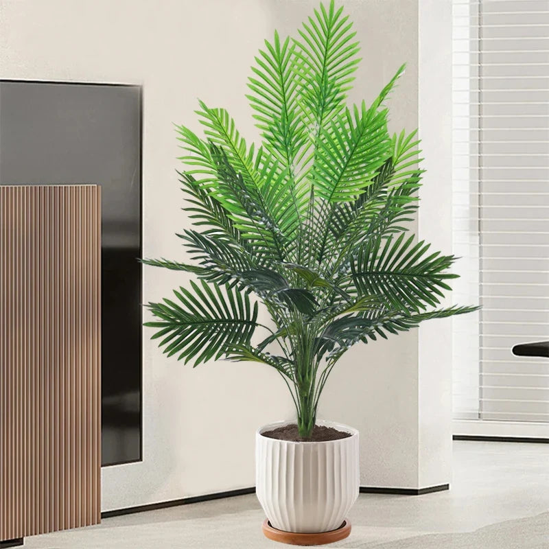 Artificial plastic palm with monstera leaves for garden