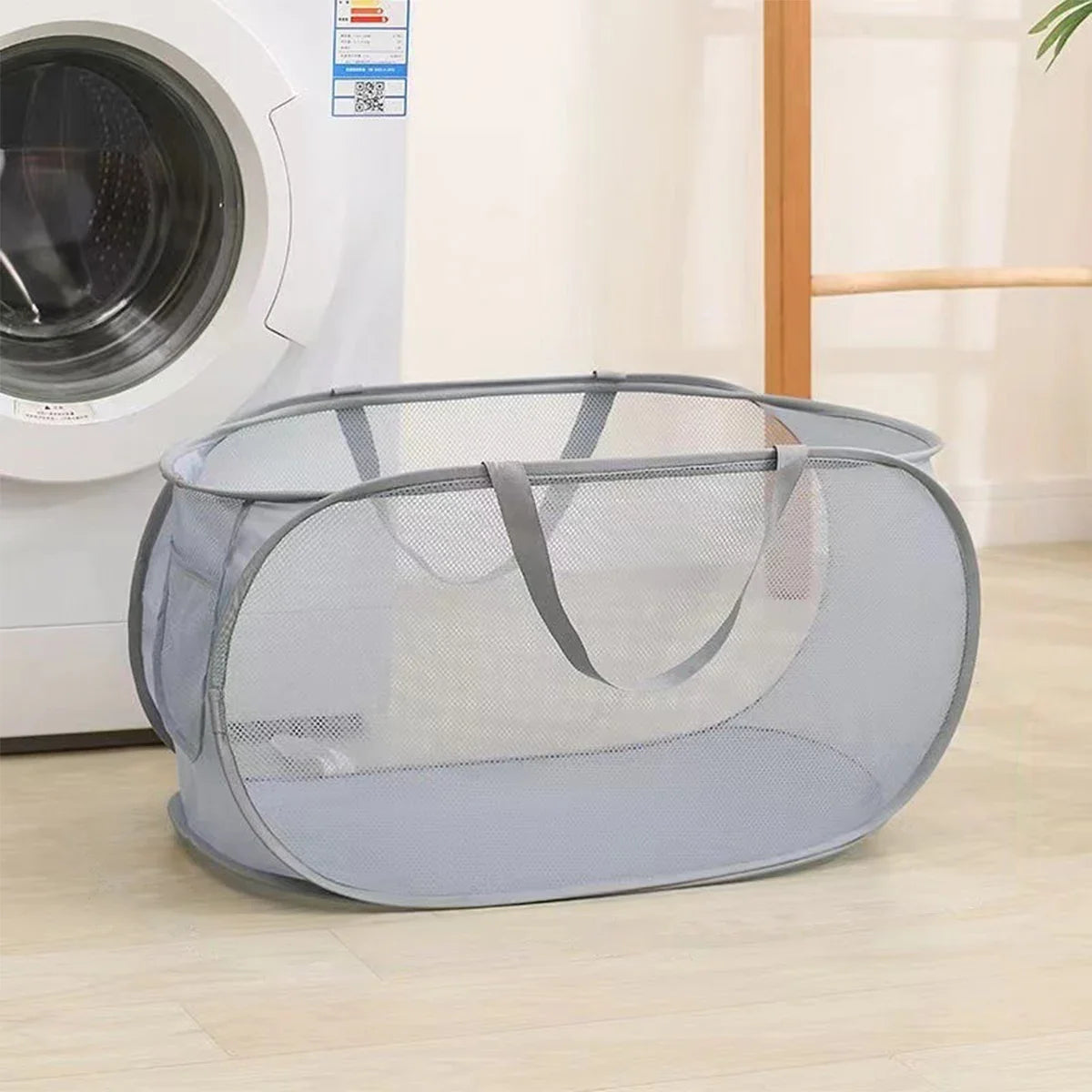 Foldable linen basket with practical handles and pockets