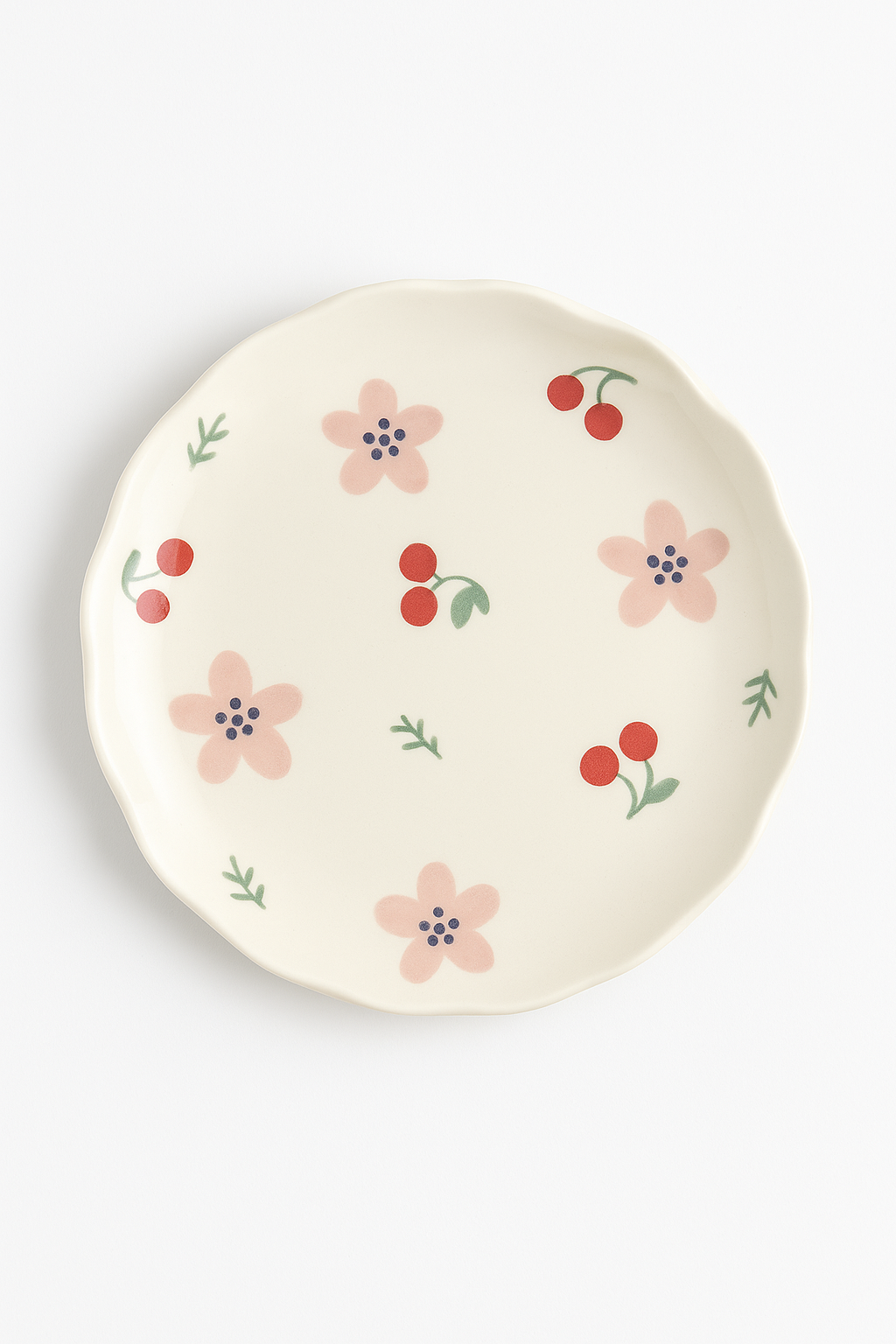 Ceramic cake plate with a coreen floral pattern