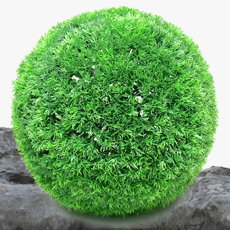 Artificial grass ball in decorative pine needles