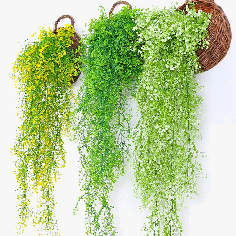 Wall decoration in rattan with leaves and golden bell