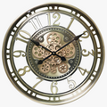 Ancient wall clock in decorative metal with gears